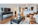 Comfortable living room featuring hard wood floors, stylish decor, and modern lighting at 1777 Larimer St # 1203, Denver, CO 80202