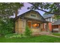 Charming brick home with covered porch and beautiful lawn at 1172 Harrison St, Denver, CO 80206