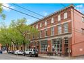 Attractive three-story brick building with large windows and street parking available at 3211 Zuni St # 14, Denver, CO 80211