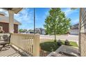 Cozy front porch view with decorative potted plants and charming neighborhood street at 7888 Tejon St, Denver, CO 80221