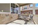 Covered front porch featuring seating area with comfortable chairs and decorative flowers at 7888 Tejon St, Denver, CO 80221