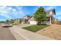 Picturesque street view of well-maintained homes with manicured lawns and sidewalks at 7888 Tejon St, Denver, CO 80221