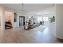 Open-concept living room features hardwood floors, comfortable seating, and plenty of natural light at 18155 Flowered Meadow Ln, Monument, CO 80132