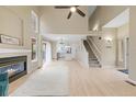 Bright living room boasts vaulted ceilings, a cozy fireplace, and easy access to the kitchen at 3565 W 112Th Cir, Westminster, CO 80031