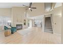 Bright living room boasts vaulted ceilings, a cozy fireplace, and easy access to the kitchen at 3565 W 112Th Cir, Westminster, CO 80031
