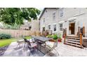 Inviting backyard with paved patio, perfect for outdoor dining and entertaining, surrounded by lush greenery at 1266 N Pearl St, Denver, CO 80203