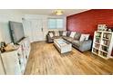 Living room boasting neutral tones, natural light, and a cozy sectional sofa at 6800 E Tennessee Ave # 351, Denver, CO 80224