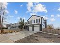 Beautiful two-story home featuring painted brick and siding, an attached garage, and a landscaped front yard at 16402 E Tennessee Ave, Aurora, CO 80017