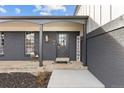 Charming entryway with painted brick, decorative lanterns, and a welcoming welcome sign at 16402 E Tennessee Ave, Aurora, CO 80017