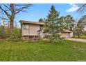 Charming home featuring a well-maintained front yard and an attached two-car garage at 784 W Sterne Pkwy, Littleton, CO 80120