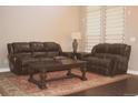 Comfortable living room featuring plush seating and a neutral color palette at 4746 Raven Run, Broomfield, CO 80023