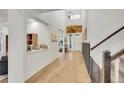 Grand entryway with soaring ceilings, hardwood floors, and abundant natural light at 16060 Fairway, Commerce City, CO 80022