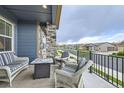 Relaxing front porch with comfortable seating, offering a pleasant outdoor living space at 12930 Bobcat Ct, Broomfield, CO 80021