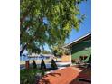 View of the house and front yard with a mature tree providing shade and curb appeal at 13298 Alcott Cir, Broomfield, CO 80020