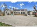 Expansive backyard patio with stone accents, a grill, and charming seating creating a welcoming outdoor space at 7060 Holly St, Commerce City, CO 80022