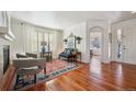 Cozy living room with hardwood floors, stylish furnishings, and ample natural light, creating an inviting atmosphere at 16403 River Haven Way, Morrison, CO 80465