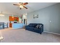 Open-concept layout with living room flowing seamlessly into the kitchen and dining area at 2682 S Cathay Way # 307, Aurora, CO 80013