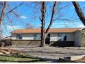 Attractive single-story house featuring decorative rock landscaping, and an inviting front porch at 3190 S Joplin Ct, Aurora, CO 80013