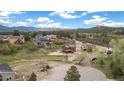 A high angle aerial view of the property showing multiple houses and gorgeous landscape at 826 Meadow Ln, Palmer Lake, CO 80133