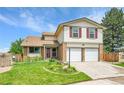 Charming two-story home featuring a well-manicured lawn and a two-car garage at 11149 Seton Pl, Westminster, CO 80031