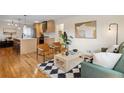 Open living room featuring hardwood floors, contemporary furnishings, and stylish decor at 2800 N Harrison St, Denver, CO 80205