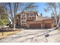 Inviting home with a three-car garage, set back from the street, and mature trees at 6406 Eagle Ct, Longmont, CO 80503