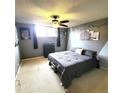 Spacious bedroom with ceiling fan and large TV at 2375 S Linden Ct # 104, Denver, CO 80222