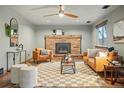 Inviting living room with brick fireplace, plush seating, and stylish decor, creating a cozy atmosphere at 3053 Mcintosh Dr, Longmont, CO 80503