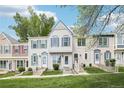 Charming townhome with manicured lawn, decorative trim, and inviting front entrance at 6722 S Independence St, Littleton, CO 80128