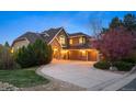 Beautifully landscaped home with large driveway and three car garage at 7284 Timbercrest Ln, Castle Pines, CO 80108