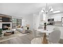 Bright living room boasts a fireplace, balcony access, and connects seamlessly to the modern kitchen and dining area at 14720 E Kentucky Dr # 622, Aurora, CO 80012