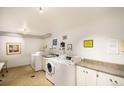 Clean and well-maintained laundry room with modern washer and dryer units at 1085 N Lafayette St # 602, Denver, CO 80218