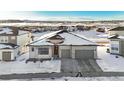 Stunning aerial view of a house with a snow covered yard at 239 Rogers Ct, Castle Rock, CO 80104