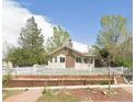Charming home featuring a classic white picket fence and manicured front yard at 5040 Tennyson St, Denver, CO 80212