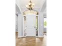 Elegant foyer featuring a hardwood floor, and a front door with decorative glass at 3380 Quail Ct, Wheat Ridge, CO 80033