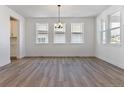 Bright dining room with hardwood floors and chandelier at 8773 Yellowcress St, Littleton, CO 80125