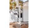 A clear view of the front door, the house number, and the mailbox at 309 S Hudson St, Denver, CO 80246