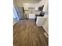Bright kitchen featuring white cabinets, stainless steel appliances, and modern countertops at 5552 Abilene St, Denver, CO 80239