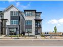 Modern home with stone and gray siding offering a small balcony at 1787 W 166Th Ave, Broomfield, CO 80023