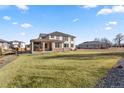 Expansive backyard with a covered patio, perfect for outdoor living and entertaining at 15 Latigo Pl, Littleton, CO 80123