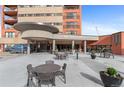 Welcoming entrance to 100 Park Avenue West with outdoor seating at 100 Park W Ave # 1804, Denver, CO 80205