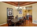 Elegant dining room featuring hardwood floors and stylish chandelier at 11023 Glengate Cir, Highlands Ranch, CO 80130