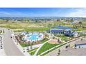 A lovely community pool area with ample seating, playground, and green spaces at 175 Westerly Blvd, Erie, CO 80516