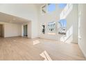 Expansive living room offering natural light, tall ceilings, and sliding door access to the patio at 4599 Windmill Dr, Brighton, CO 80601