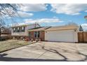 Front view of charming ranch home with mature trees at 16506 E Wesley Ave, Aurora, CO 80013