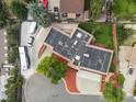 An aerial view displays the home's roof and surrounding lot at 8233 W 62Nd Pl, Arvada, CO 80004
