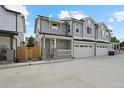 Charming two-story home with a two-car garage, gray siding, and white trim at 4018 Upham St, Wheat Ridge, CO 80033