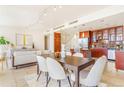 Living room and dining area features a modern lighting fixture at 1201 N Williams St # 3B, Denver, CO 80218