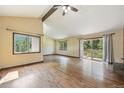 Bright and airy living room featuring hardwood floors, a vaulted ceiling, and natural light at 1037 Wagonwheel Gap Rd, Boulder, CO 80302