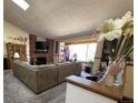 Bright and airy living room with a fireplace, large windows, and comfortable seating at 4231 S Fairplay Cir # A, Aurora, CO 80014